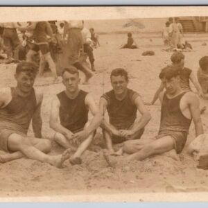 Beach Scene Men Sitting On The beach Wearing Old Bathing Suits Postcard RPPC