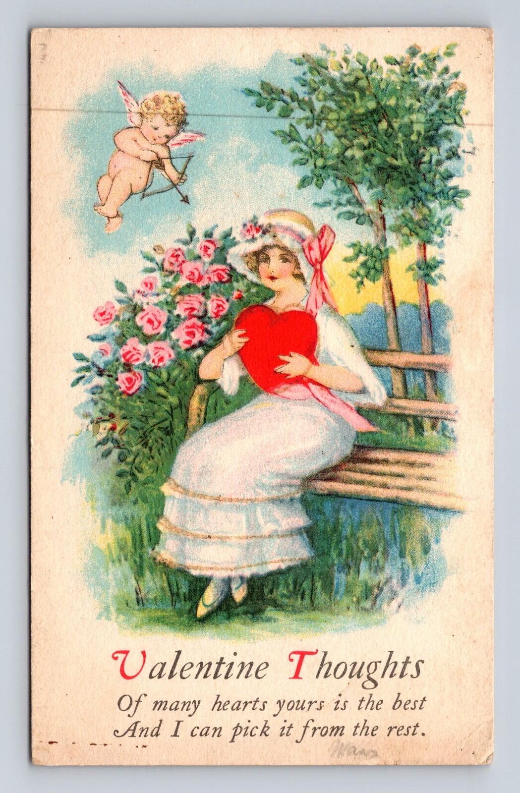 Valentine Thoughts Postcard Girl Sitting On Bench Cupid Pointing An Arrow At Her